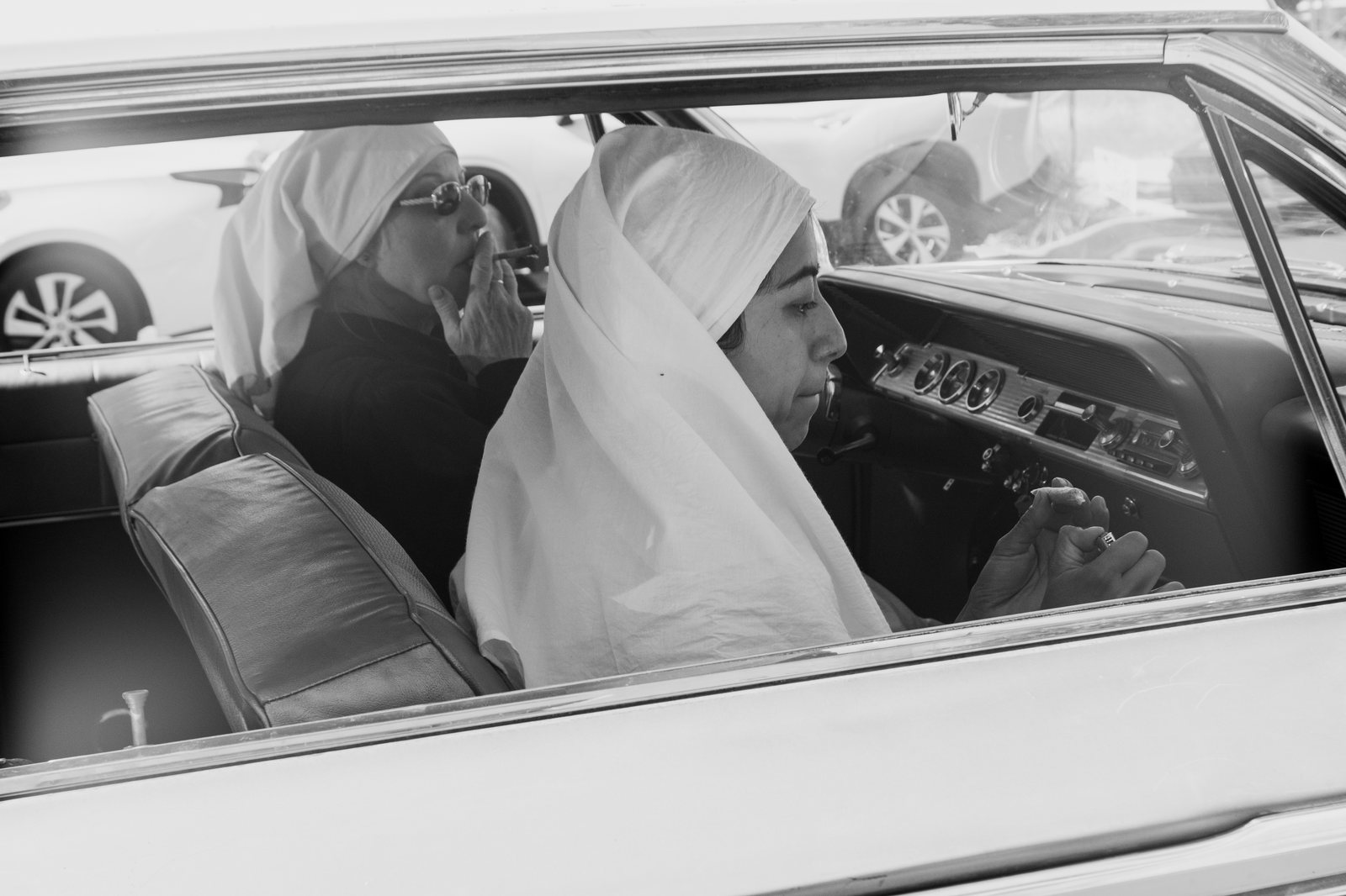 Two Sisters riding in a vintage car